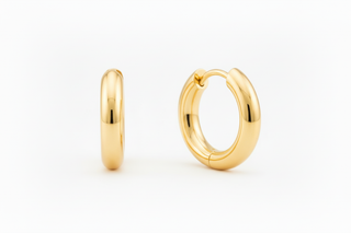 Yellow gold huggie hoops